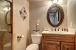 Guest bathroom with shower, custom cabinet vanity, lavatory